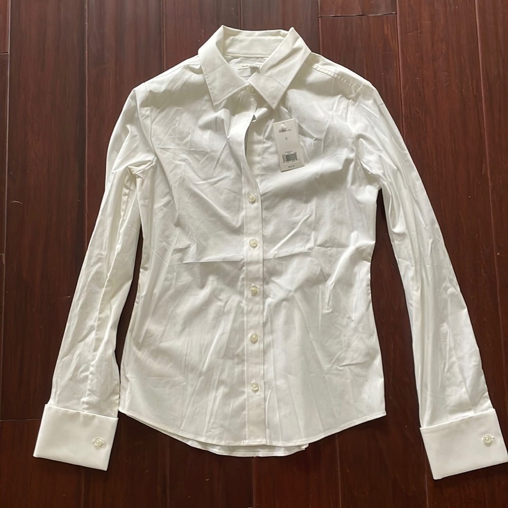 White tailored button down from Banana Republic. Size 0, stretch.